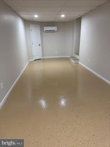 a bathroom with a toilet a sink and shower