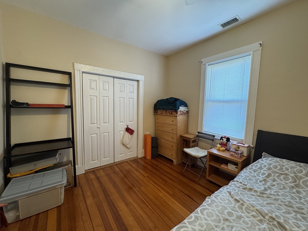 28 Quirk Street, Unit 28 Watertown, MA 02472 - Photo 12 of 23 a bedroom with bed and a dresser