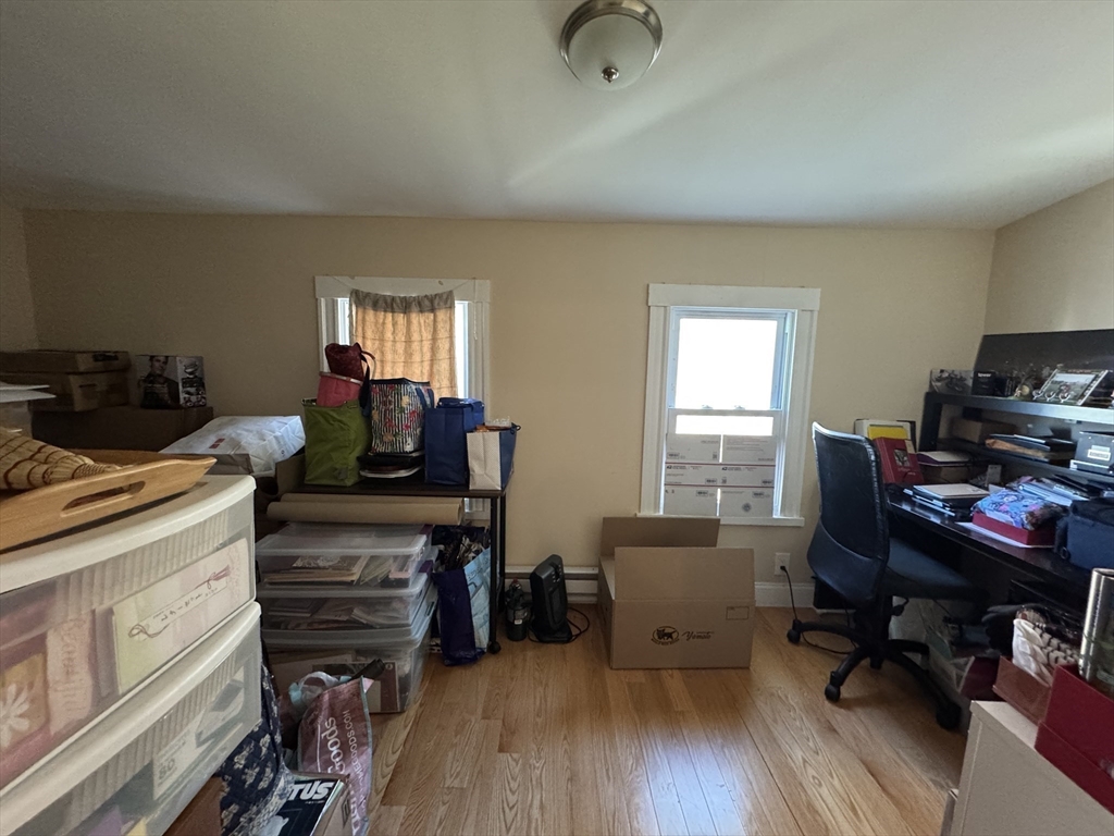 28 Quirk Street, Unit 28 Watertown, MA 02472 - Photo 13 of 23 a view of a workspace with furniture and a window