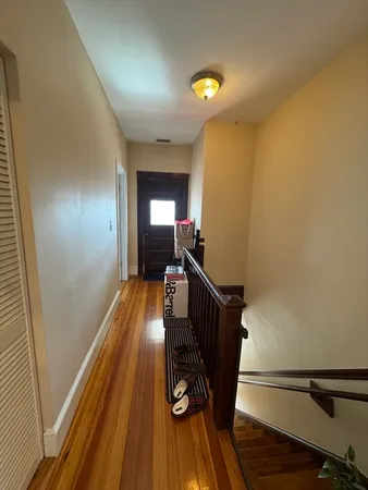 a view of entryway with wooden floor