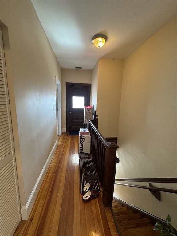 28 Quirk Street, Unit 28 Watertown, MA 02472 - Photo 17 of 23 a view of entryway with wooden floor