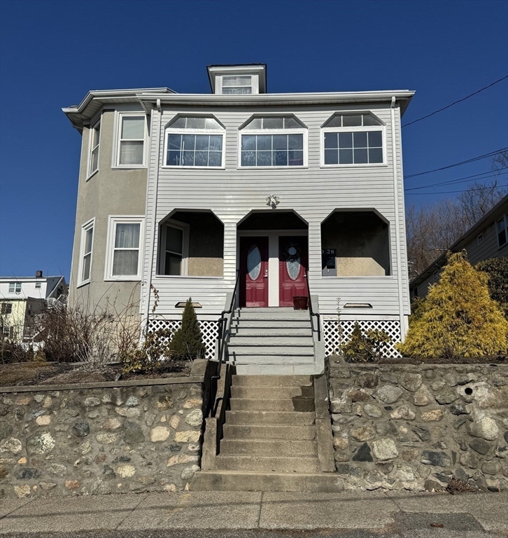 28 Quirk Street, Unit 28 Watertown, MA 02472 - Photo 19 of 23 a front view of a house with windows