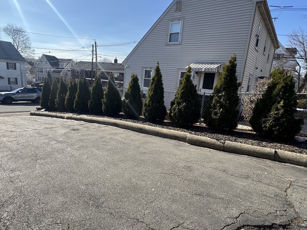 28 Quirk Street, Unit 28 Watertown, MA 02472 - Photo 21 of 23 a view of a building with many windows