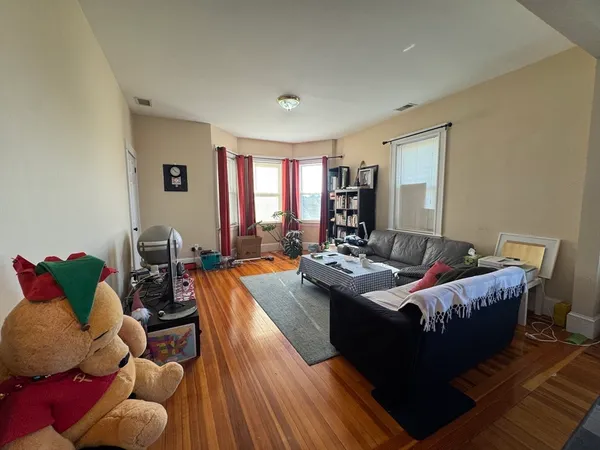 a living room with furniture and a table