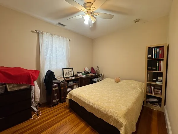 a bed room with a bed and a television