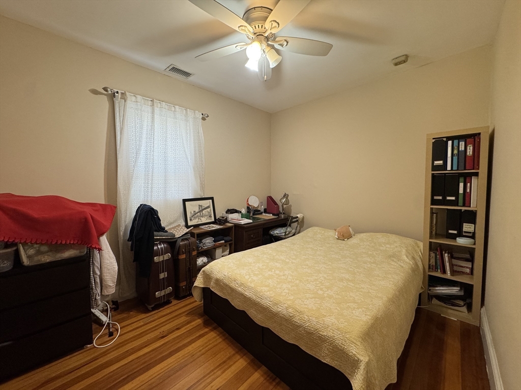 28 Quirk Street, Unit 28 Watertown, MA 02472 - Photo 8 of 23 a bed room with a bed and a television