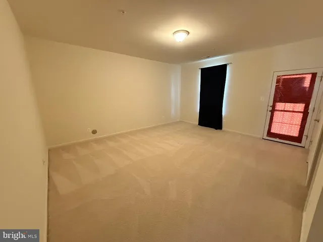 a view of kitchen with cabinets and wooden floor