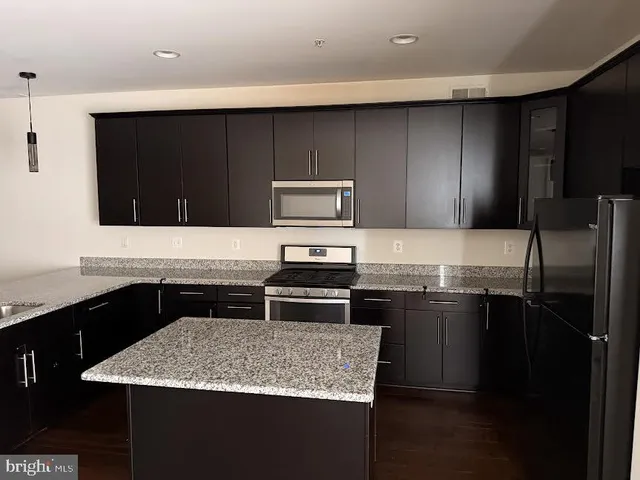 a kitchen with a sink and a stove
