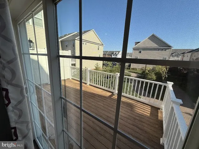 a view of staircase with a chair