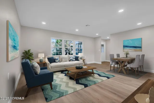 a living room with furniture wooden floor and a table