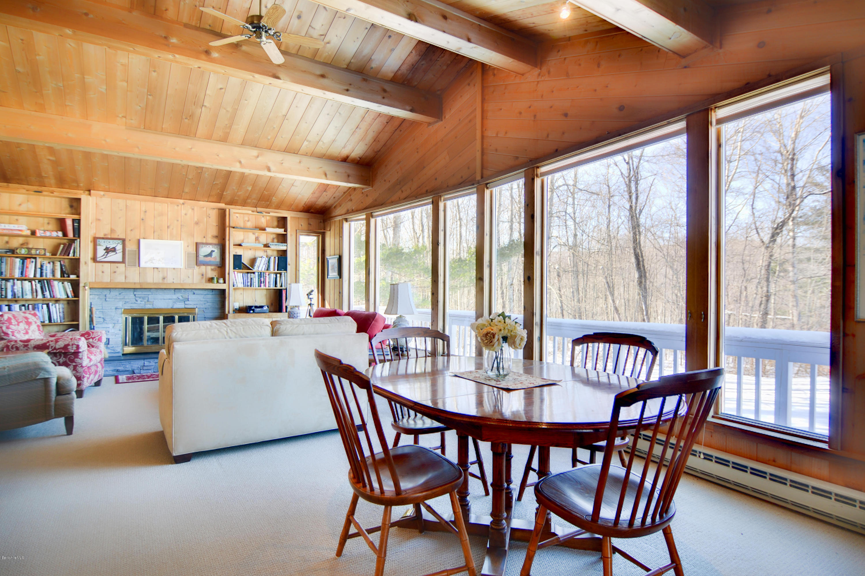 137 Whitman Road Hancock, MA 01267 - Photo 11 of 37 a dining room with furniture a chandelier and wooden floor