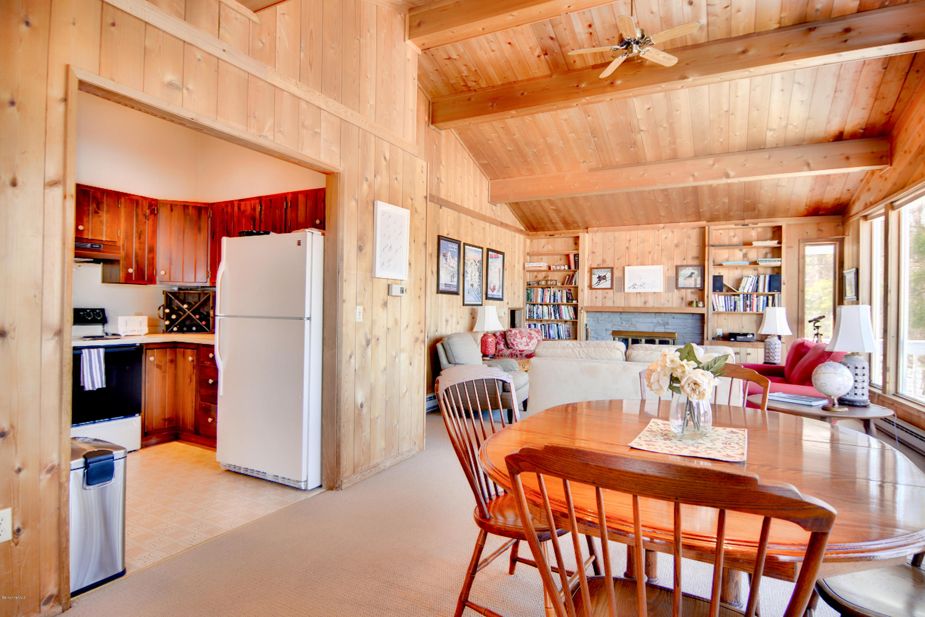 137 Whitman Road Hancock, MA 01267 - Photo 18 of 37 a dining room with furniture and a kitchen view
