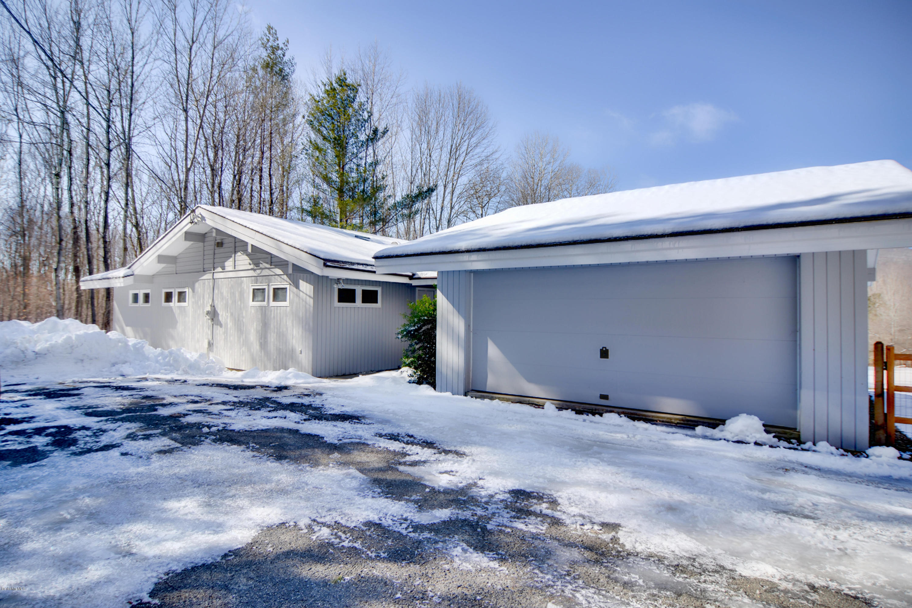137 Whitman Road Hancock, MA 01267 - Photo 3 of 37 a view of a house with a snow