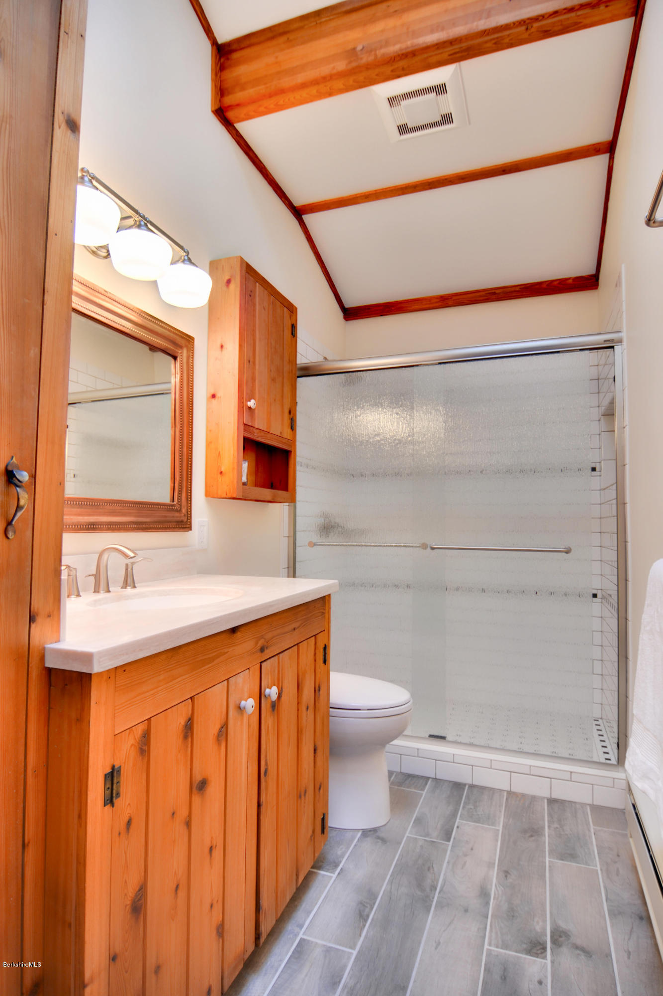 137 Whitman Road Hancock, MA 01267 - Photo 22 of 37 a bathroom with a sink a toilet and mirror