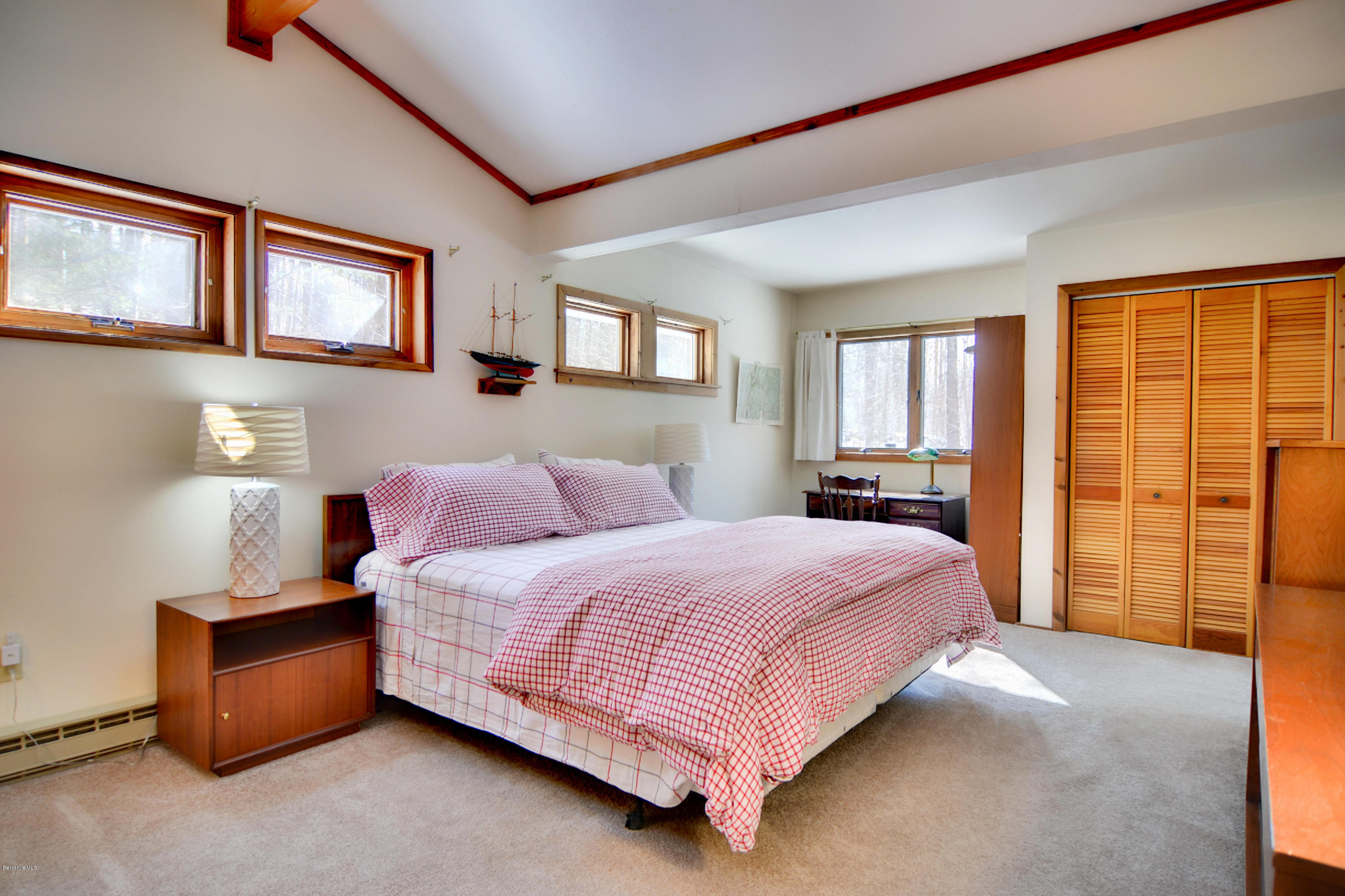 137 Whitman Road Hancock, MA 01267 - Photo 23 of 37 a bedroom with a large bed and a window