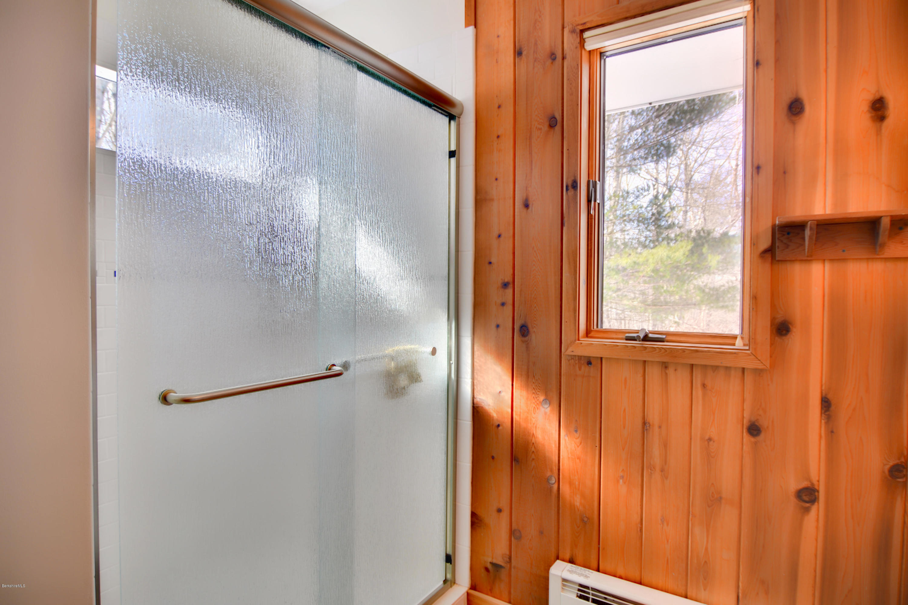 137 Whitman Road Hancock, MA 01267 - Photo 27 of 37 a bathroom with a glass shower door