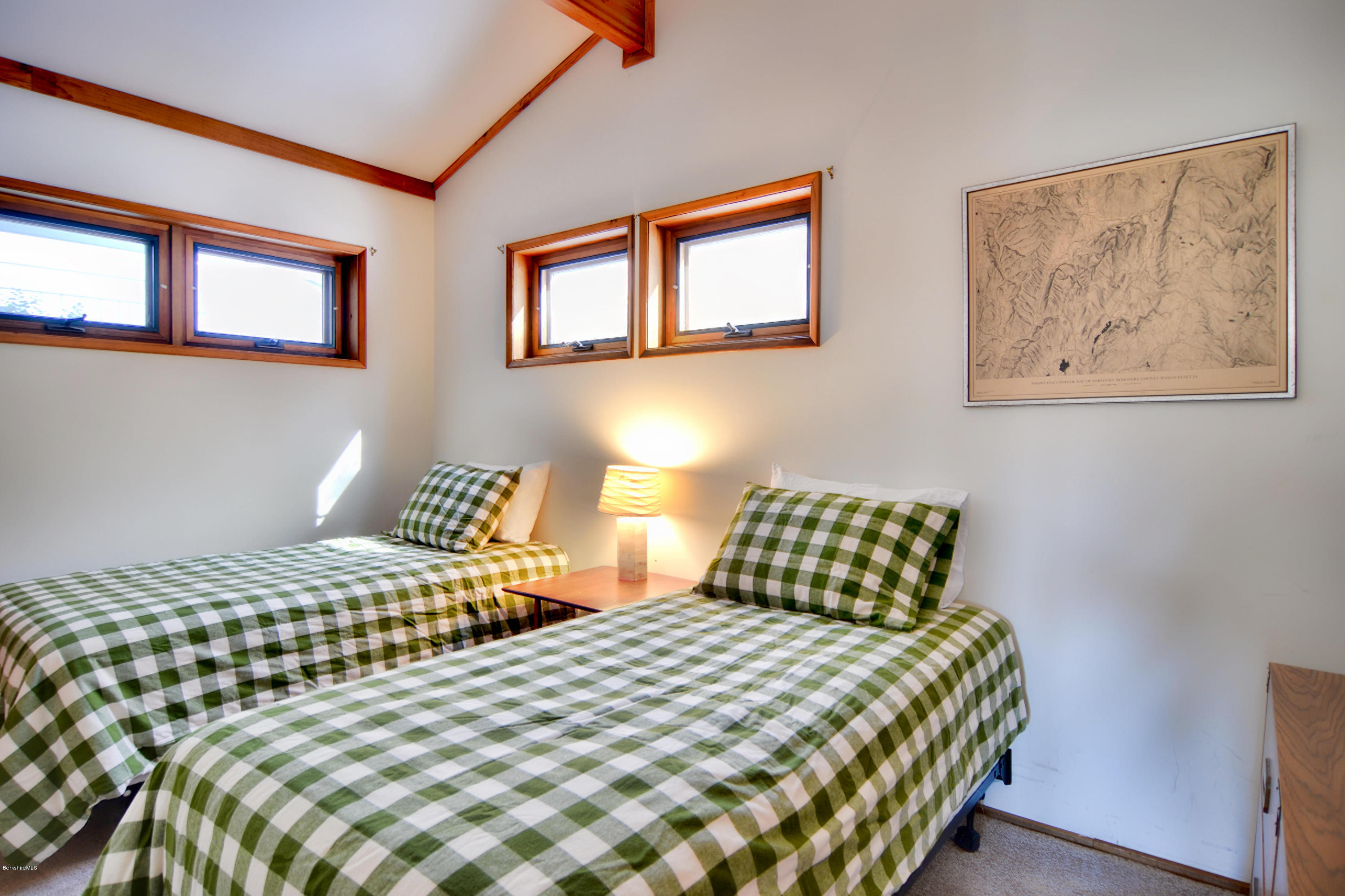 137 Whitman Road Hancock, MA 01267 - Photo 28 of 37 a bedroom with a bed and lamp