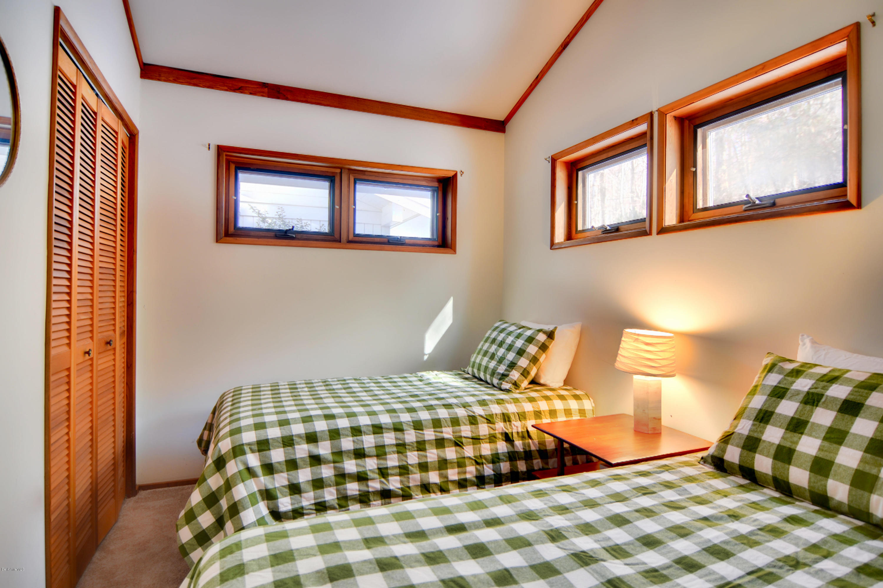 137 Whitman Road Hancock, MA 01267 - Photo 29 of 37 a bedroom with a bed and painting on the wall