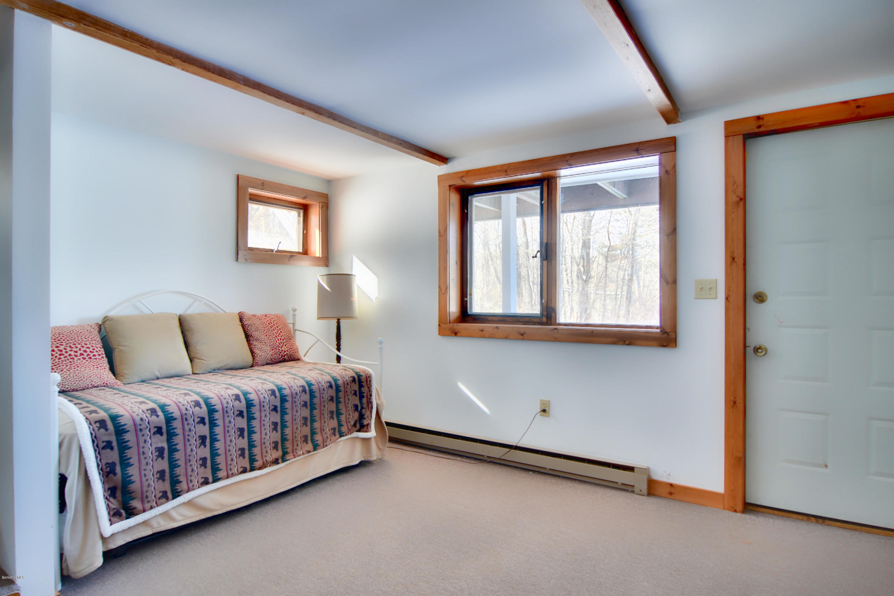 137 Whitman Road Hancock, MA 01267 - Photo 32 of 37 a bedroom with a bed and a window