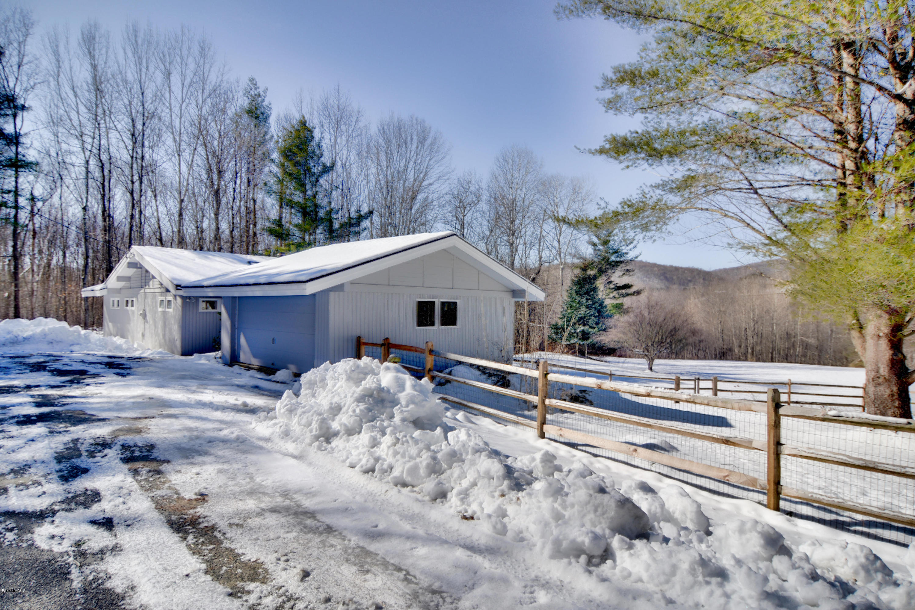 137 Whitman Road Hancock, MA 01267 - Photo 36 of 37 a view of a house with a yard and large tree
