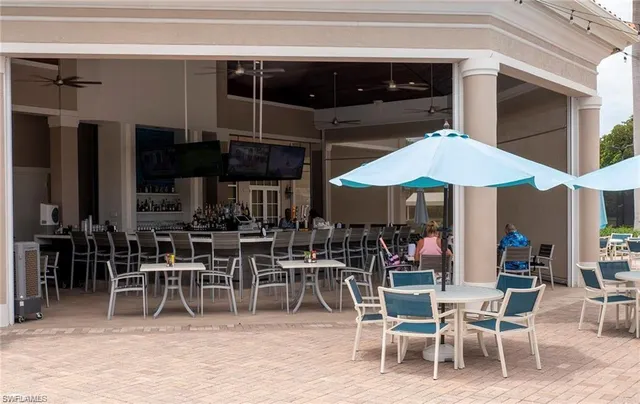a view of a dining room with chairs and tables