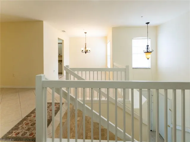 a view of a balcony with wooden floor