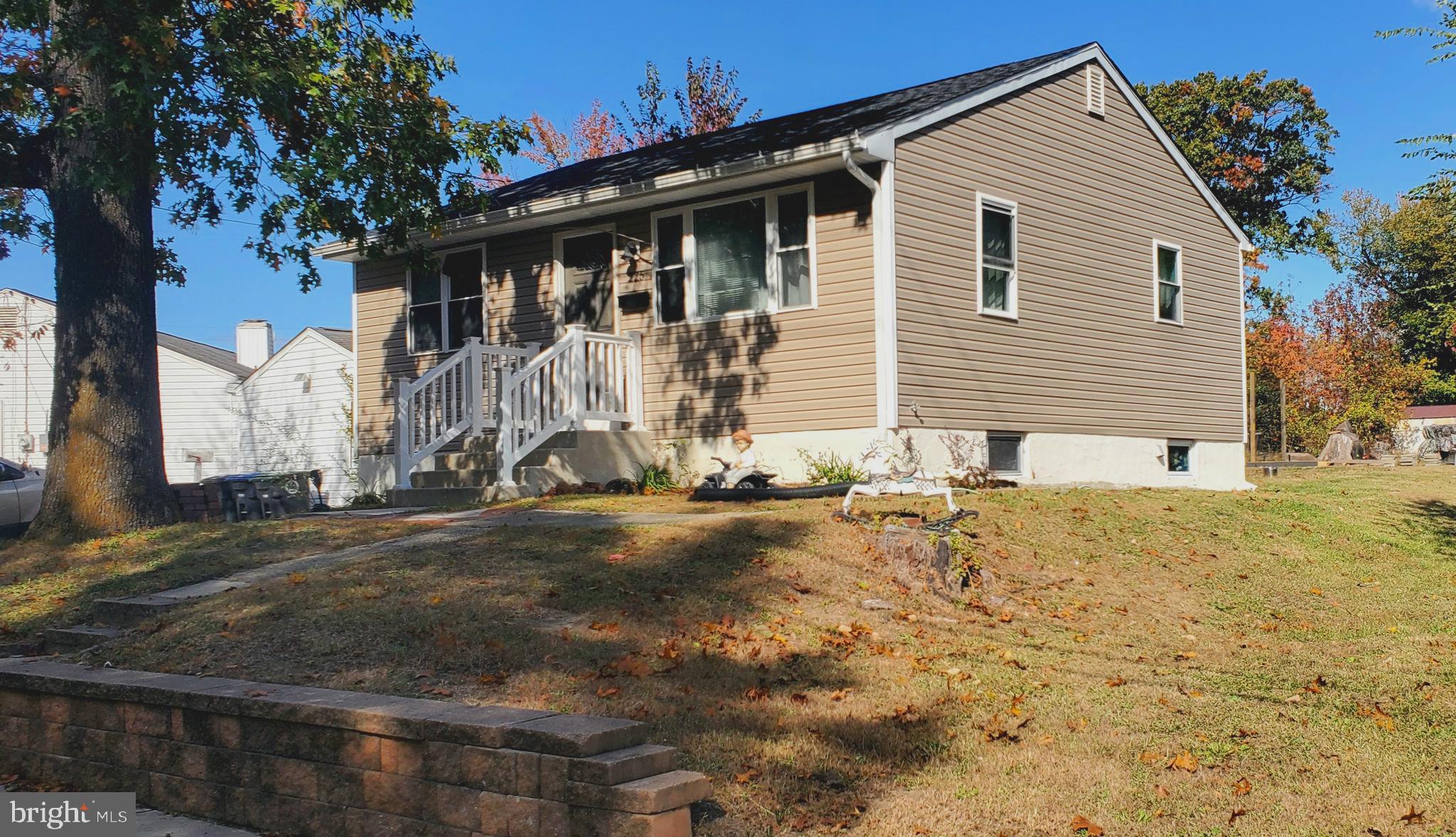 a view of a house with snow on the road