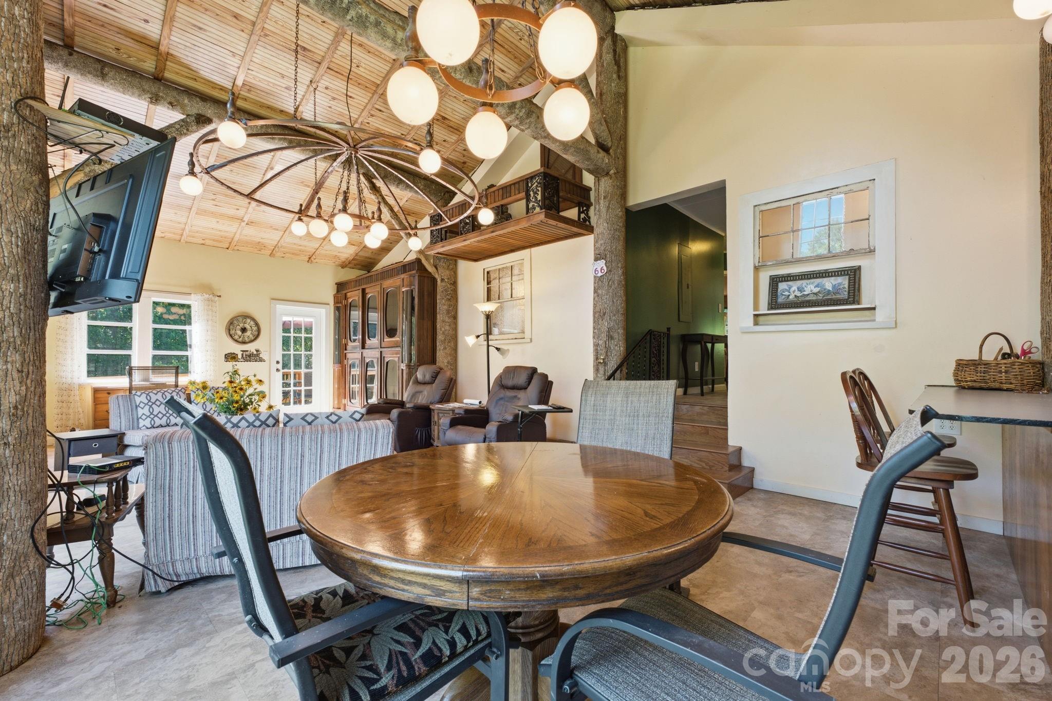 583 Dark Ridge Road Sylva, NC 28779 - Photo 39 of 48 a dining room with furniture and wooden floor