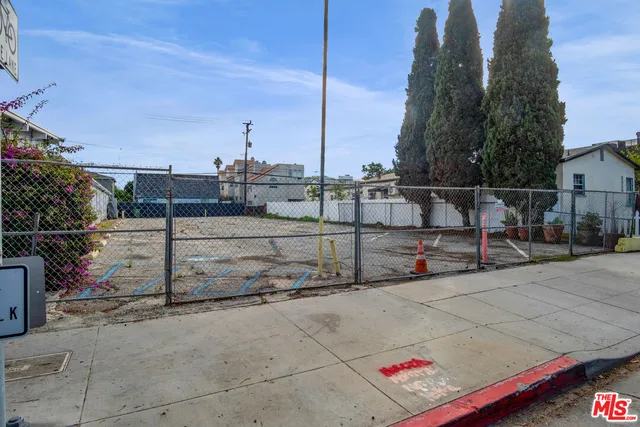 a view of a house with potted plants