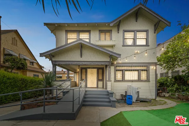 a front view of a house with garage