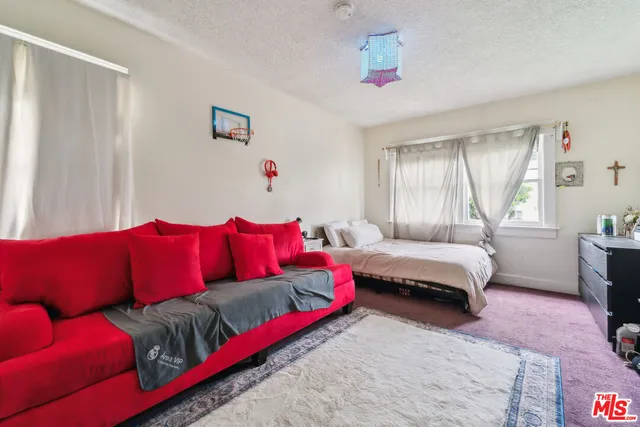 a living room with a couch and a window