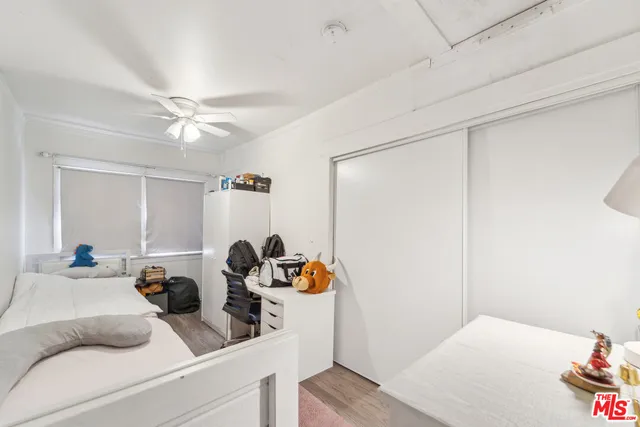 a view of living room with furniture and gym equipment