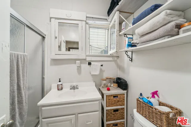 a utility room with closet dryer and washer
