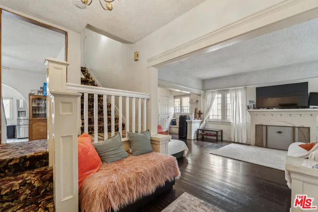 a living room with furniture fireplace and flat screen tv
