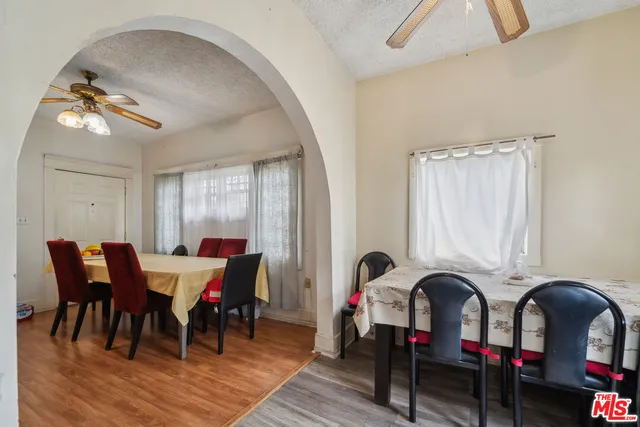 a view of a dining room with furniture and chandelier