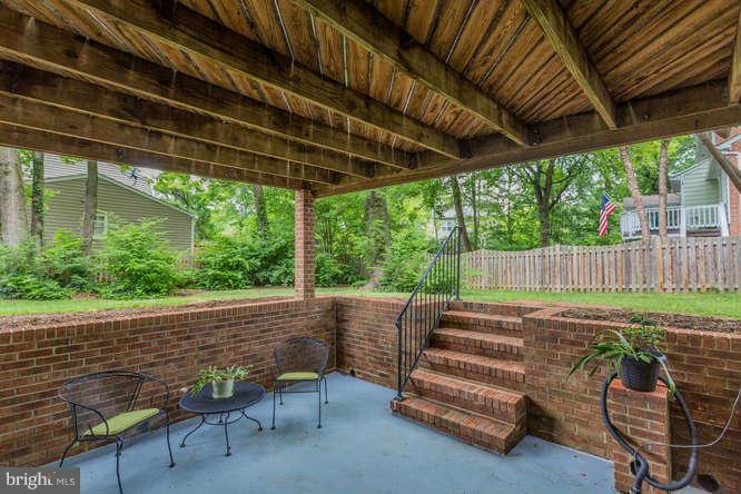 715 Marshall Road Southwest Vienna, VA 22180 - Photo 28 of 29 Brick Patio to Fenced Yard from Basement