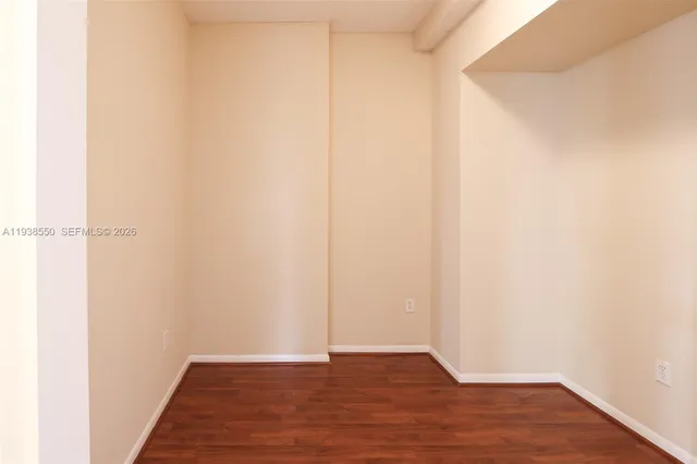 a view of a bathroom with a sink and a mirror