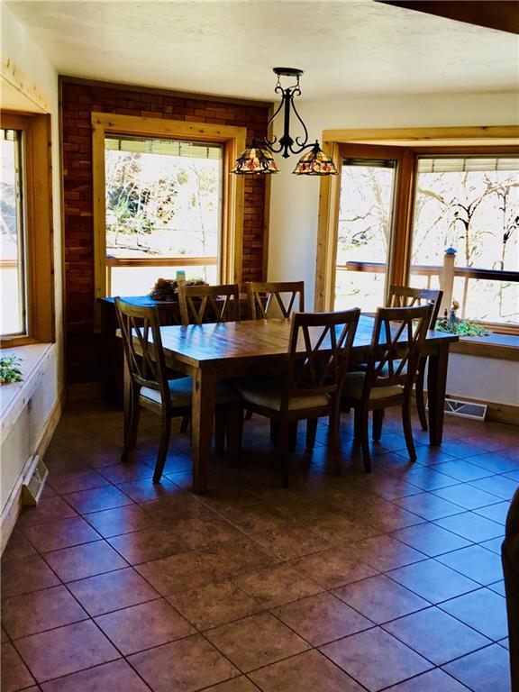 521 Stewartson Road Templeton, PA 16259 - Photo 8 of 25 a view of a dining room with furniture and window