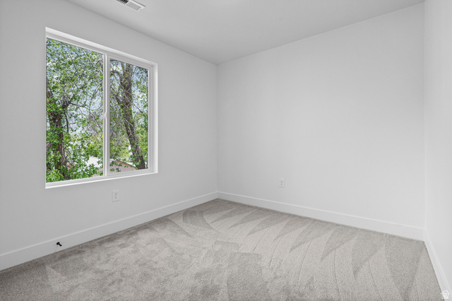 340 East 7635 S Street Sandy, UT 84047 - Photo 19 of 32 Unfurnished room with baseboards and light colored carpet