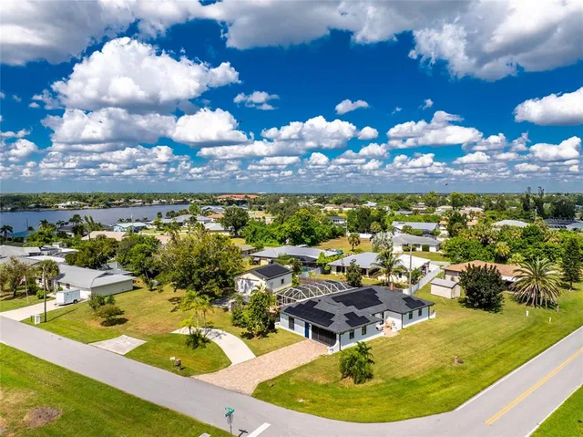 a view of a swimming pool with a table and chairs