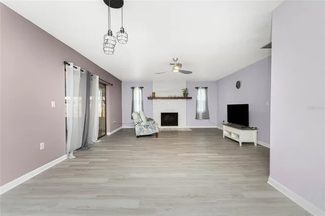 a living room with furniture flat screen tv and a fireplace