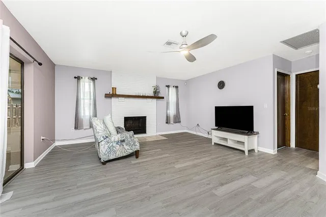 a living room with furniture and a fireplace