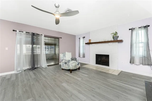 a view of a kitchen with wooden floor and a kitchen space