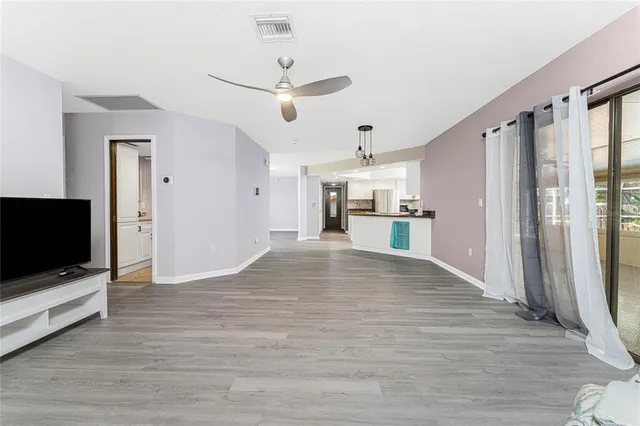 a view of a livingroom with furniture and wooden floor