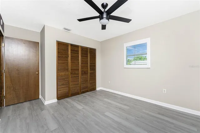 a view of a chair and tables in the patio