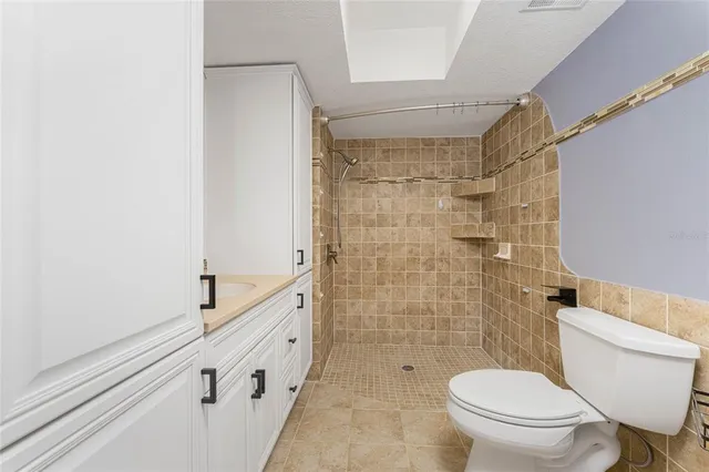 a view of a patio with table and chairs potted plants with wooden fence