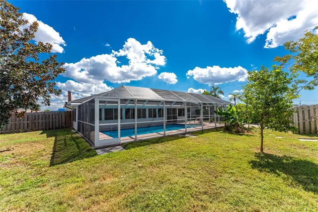 an aerial view of a pool patio swimming pool and ocean view