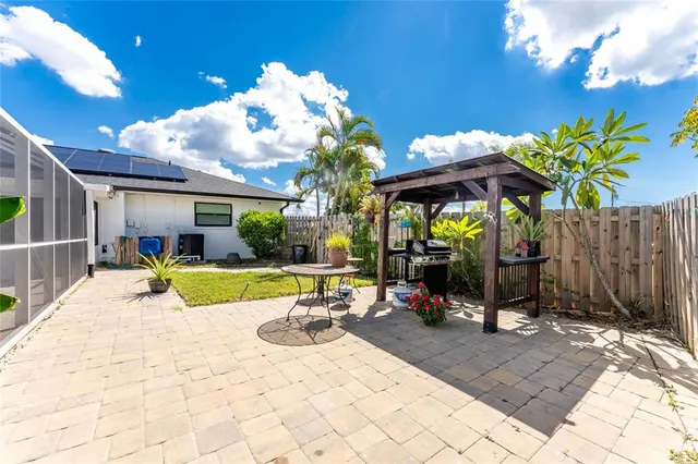 an aerial view of residential houses with outdoor space and river view