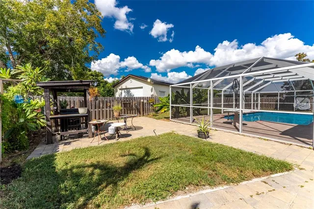 an aerial view of a house with a swimming pool