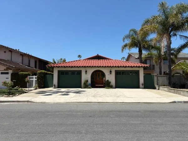 a front view of a house with a garage